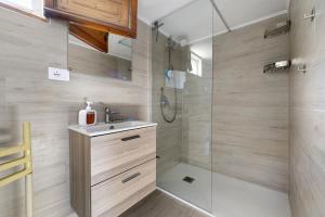 a bathroom with a shower and a sink at Villa Ondina 1 Carloforte in Carloforte
