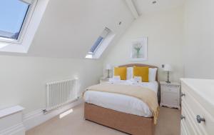 a bedroom with a bed and a window at 5 Old School Mews Shanklin in Shanklin