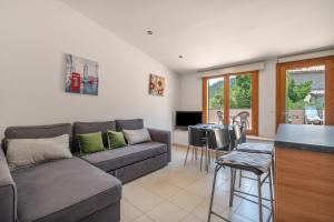 a living room with a couch and a table at Casa Nord in El Port de la Selva