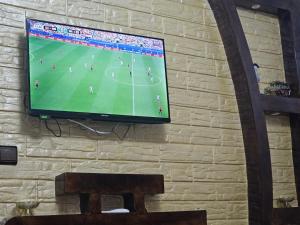 a flat screen tv hanging on a wall at Belyounech in Belyounech 