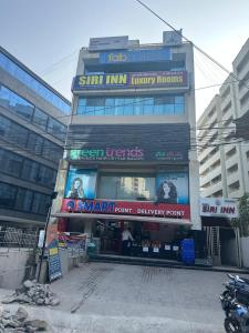 a building with a sign on the side of it at Hotel Siri Inn Hitech City in Hyderabad