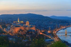 a view of the city of budapest at night at Ambra Hotel in Budapest