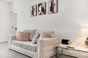 a living room with a couch and a table at Stylish 2BR House in Ashington by Stay With Us in Ashington