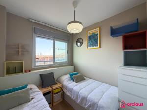 a room with two beds and a window at Altamar Imperial in Cabanes