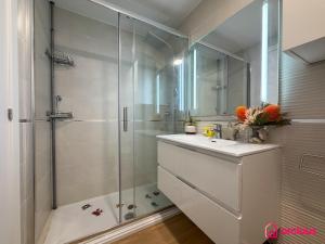 a bathroom with a shower and a sink and a toilet at Altamar Imperial in Cabanes