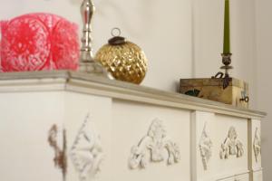 a white shelf with figurines on top of it at Alt Wien in Vienna