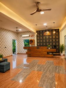 an empty lobby with a church with a potted plant at Wildline Gold Resort in Dhikuli +30 photos