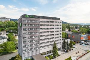 a white building with a sign on top of it at ibis Styles Bielsko Biala in Bielsko-Biała