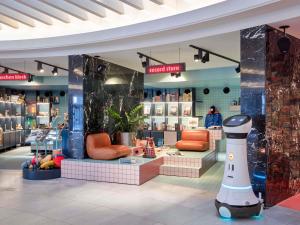 a store with a hello kitty robot in the middle at 25hours Hotel The Circle in Cologne