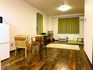 a dining room with a table and chairs at Hakodatekan - Vacation STAY 07899v in Hakodate
