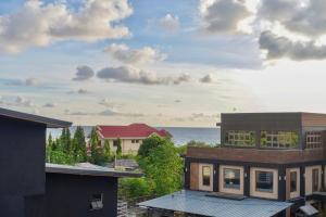 a view of the ocean from the roofs of buildings at Sea Break La Union in Balio
