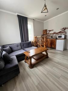 a living room with a couch and a table at Gogasar house in Ijevan