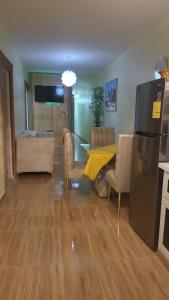 a kitchen and dining room with a table and chairs at Enjoy Life Holidays in Andrés