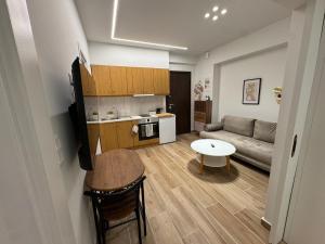 a living room with a couch and a table at Kiato City Stay in Kiaton