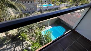 an overhead view of a swimming pool on a balcony at Pousada Castelinho in São Sebastião +220 photos