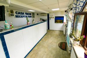a view of a room with a reception counter at Casa Yachi Vama Veche in Vama Veche