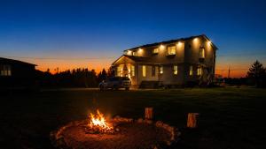 a fire pit in front of a house at night at Wonderful house in Niagara-on-the-Lake +8 photos