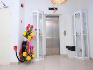 a lobby with a fire hose with flowers on it at TY Hotel in Kuala Terengganu