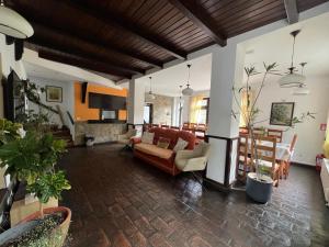 a living room with a couch and a table at Pensiunea MIS in Bran