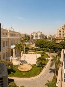 a view of a park in a city with buildings at Grand City Hotel River View in Cairo