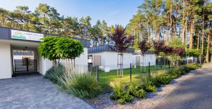 a building with a lot of plants in front of it at LABA Wieleń in Wielen Zaobrzanski