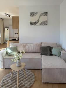 a living room with a couch and a table at Spim na Rabí in Raby