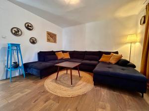 a living room with a couch and a table at Island Life in Mali Lošinj