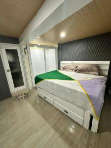 a bedroom with a large bed in a room at A.C. Asistin Transient House in Baguio +35 photos