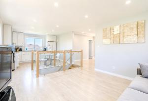 an open kitchen and living room with white walls at Wonderful house in Niagara-on-the-Lake