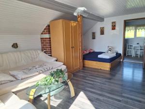 a living room with a couch and a table at David Linea House in Volavlje