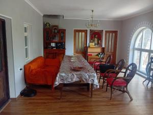 a living room with a table and a couch at Дом in Shorzha