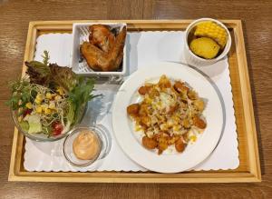 a tray of food with a plate of food and a salad at Energy Inn in Taipei +148 photos