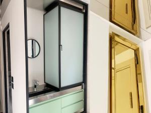 a mirror on a wall next to a door at Wontonmeen in Hong Kong +105 photos