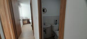 a bathroom with a toilet and a sink at Apartment Neiva Rasan in Neiva +21 photos