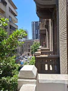 an old building with a window in a city at ReLax havanaa in Cairo