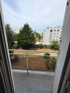 an open window with a view of a yard at Jenni Guest in Dijon