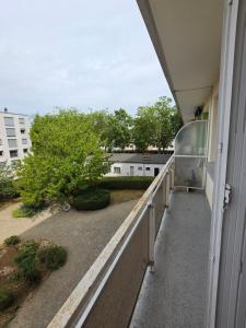 a balcony with a view of a building at Jenni Guest in Dijon