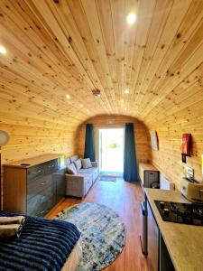a room with a bed and a kitchen in a house at The Star Inn in Dylife