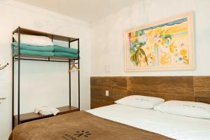 a bedroom with a bed and a bunk bed at Hotel Appel in Santa Maria