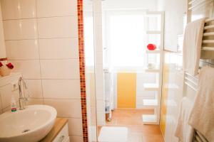a bathroom with a toilet and a sink and a shower at Ferienhaus Alb-Traum in Hayingen +23 photos
