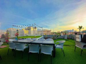 a group of tables and chairs on a roof at The Ambassador Hotel Dhaka in Dhaka
