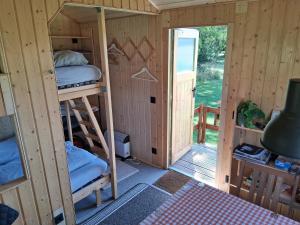 a room with two bunk beds and a doorway at Tiny House in Münster
