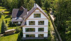 an aerial view of a white house at Szent László Residence in Mátraszentimre