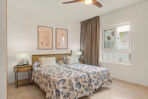 a bedroom with a bed and a ceiling fan at Callao Beach 5 in Arrieta
