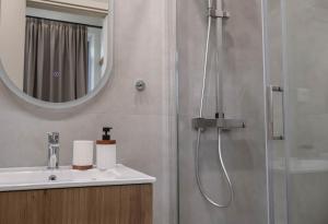 a bathroom with a shower and a sink at Ralli 34 ROOMS&APTS in Chios +156 photos