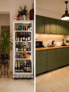 a refrigerator filled with lots of bottles of beer at Szent László Residence in Mátraszentimre
