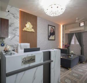 a room with a kitchen and a living room at Hotel Riddhinn6 in Jalandhar