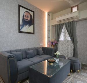 a living room with a couch and a table at Hotel Riddhinn6 in Jalandhar