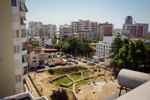 an aerial view of a city with buildings at Rooftop Apartment with Garden and Jacuzzi in Durrës