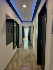 a hallway with a blue ceiling at Hotel Montenegro in Worms +82 photos